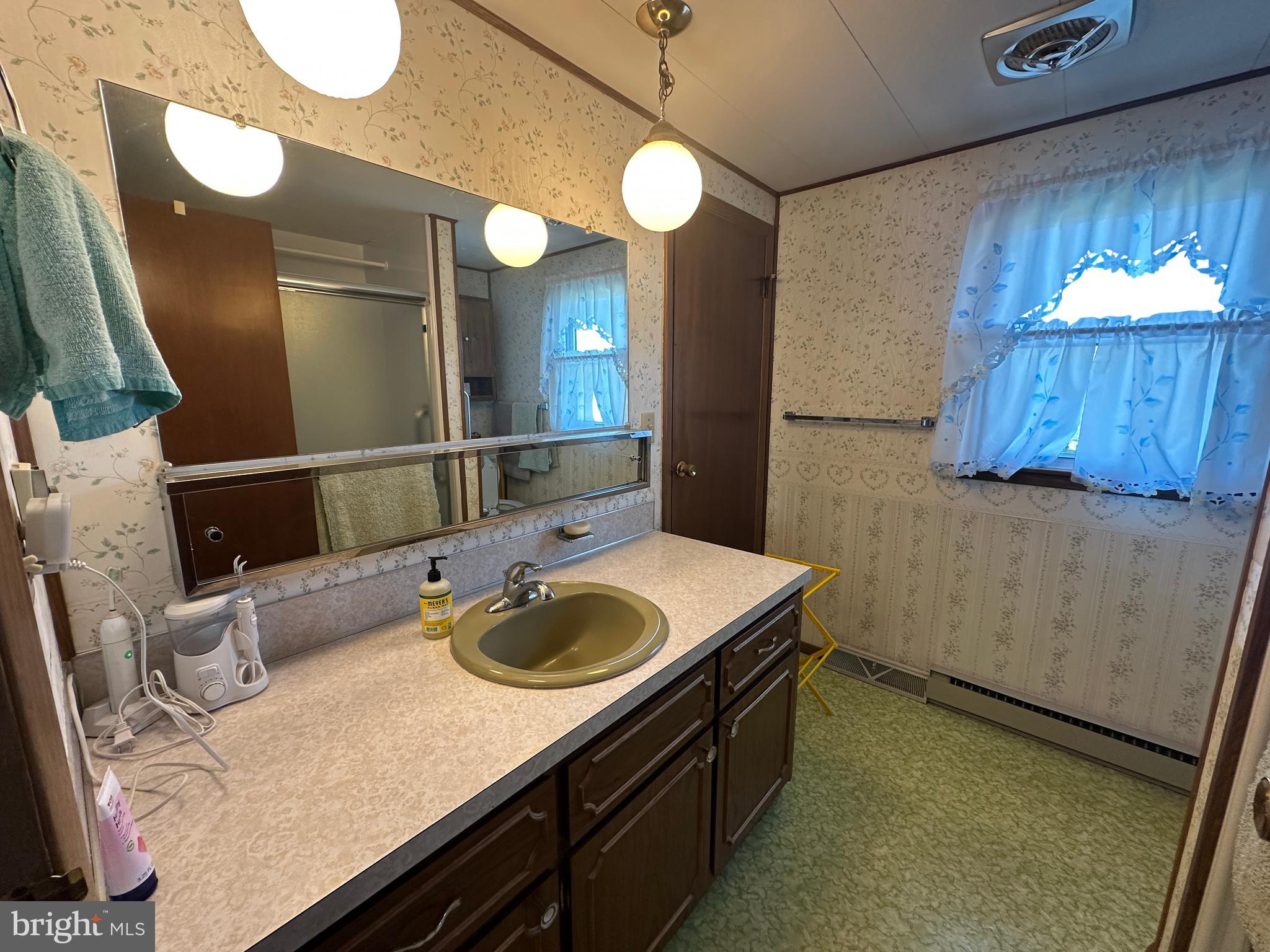 375 St Thomas-Edenville Road St. Thomas, PA 17252 - Photo 47 of 85 a bathroom with a granite countertop sink and a mirror