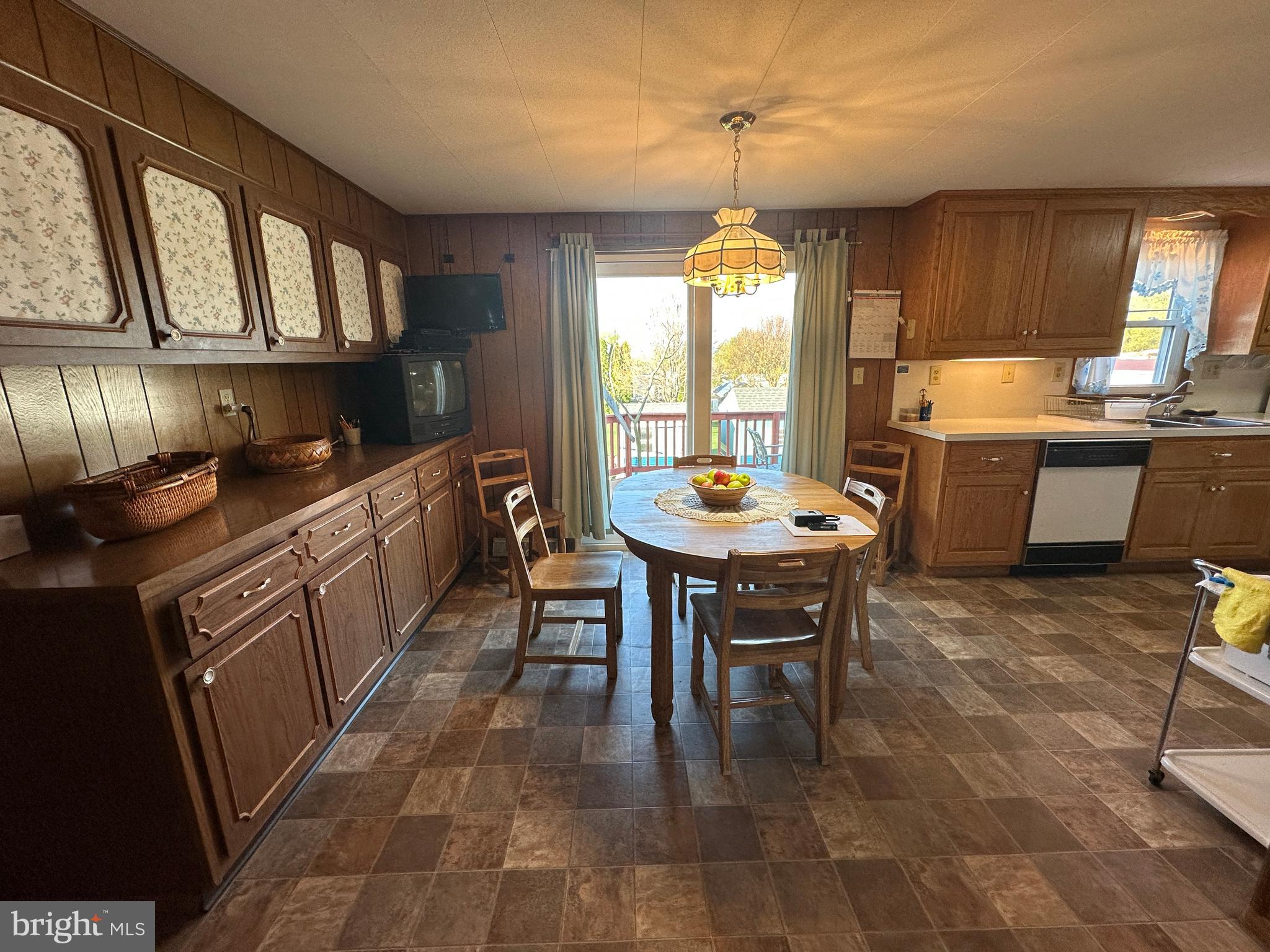 375 St Thomas-Edenville Road St. Thomas, PA 17252 - Photo 52 of 85 a kitchen with a refrigerator a stove a sink dishwasher with a dining table and chairs
