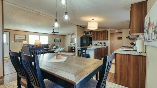 a kitchen with a dining table and chairs