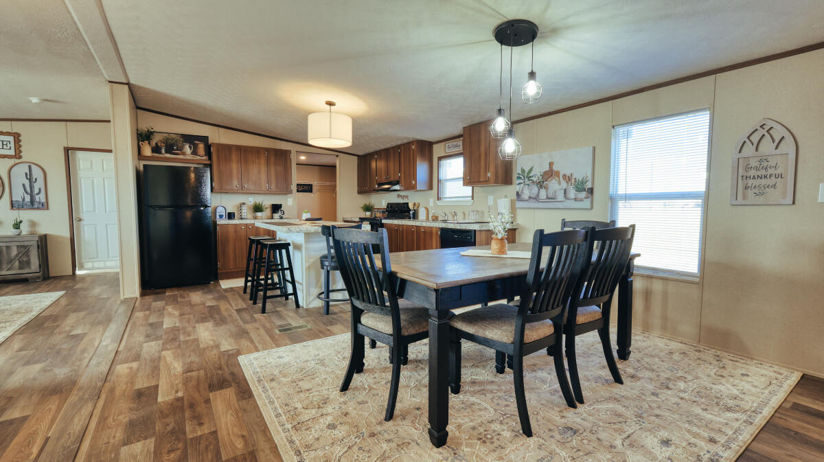 508 Sage Road Tahoka, TX 79373 - Photo 13 of 32 a dining room with furniture a chandelier and window
