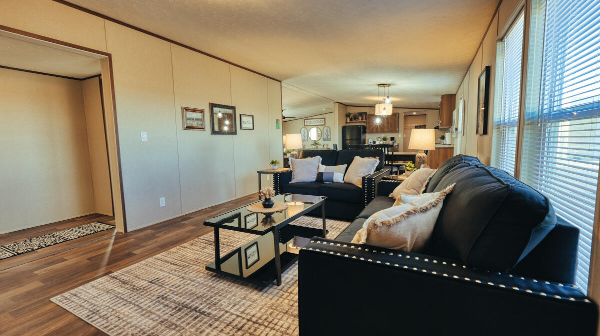 508 Sage Road Tahoka, TX 79373 - Photo 22 of 32 a living room with furniture a rug and a window