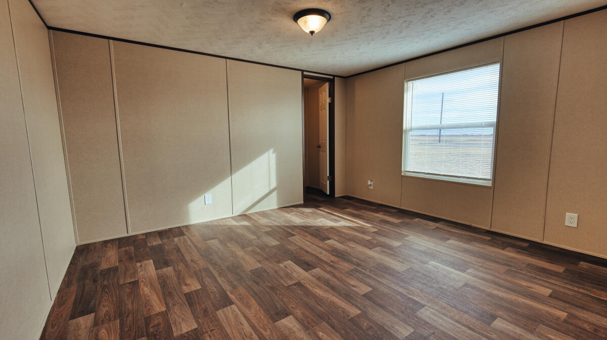 508 Sage Road Tahoka, TX 79373 - Photo 26 of 32 a view of a livingroom with wooden floor and window