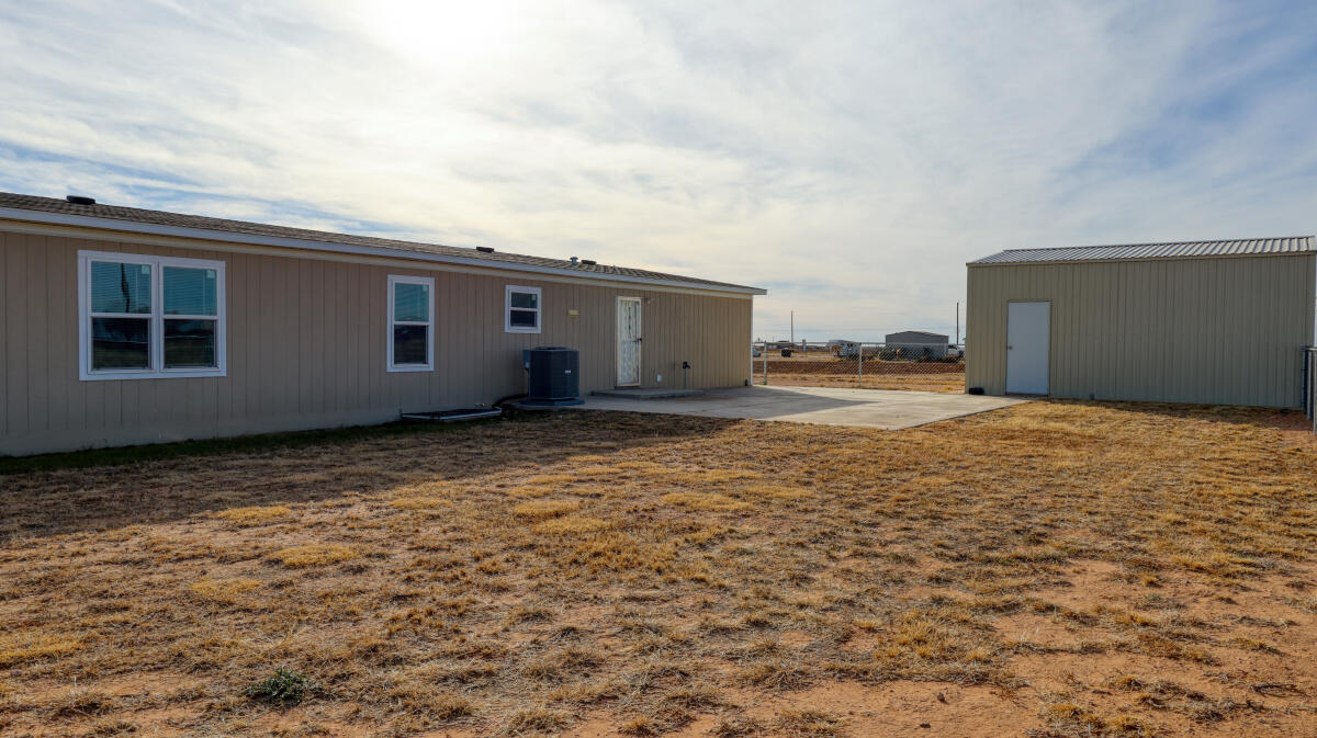 508 Sage Road Tahoka, TX 79373 - Photo 30 of 32 a view of a house with backyard and wooden fence