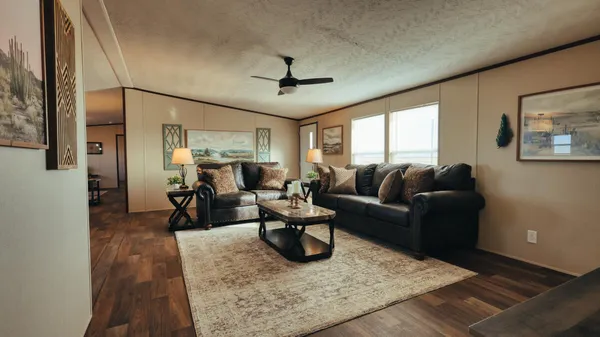 a living room with furniture rug and window