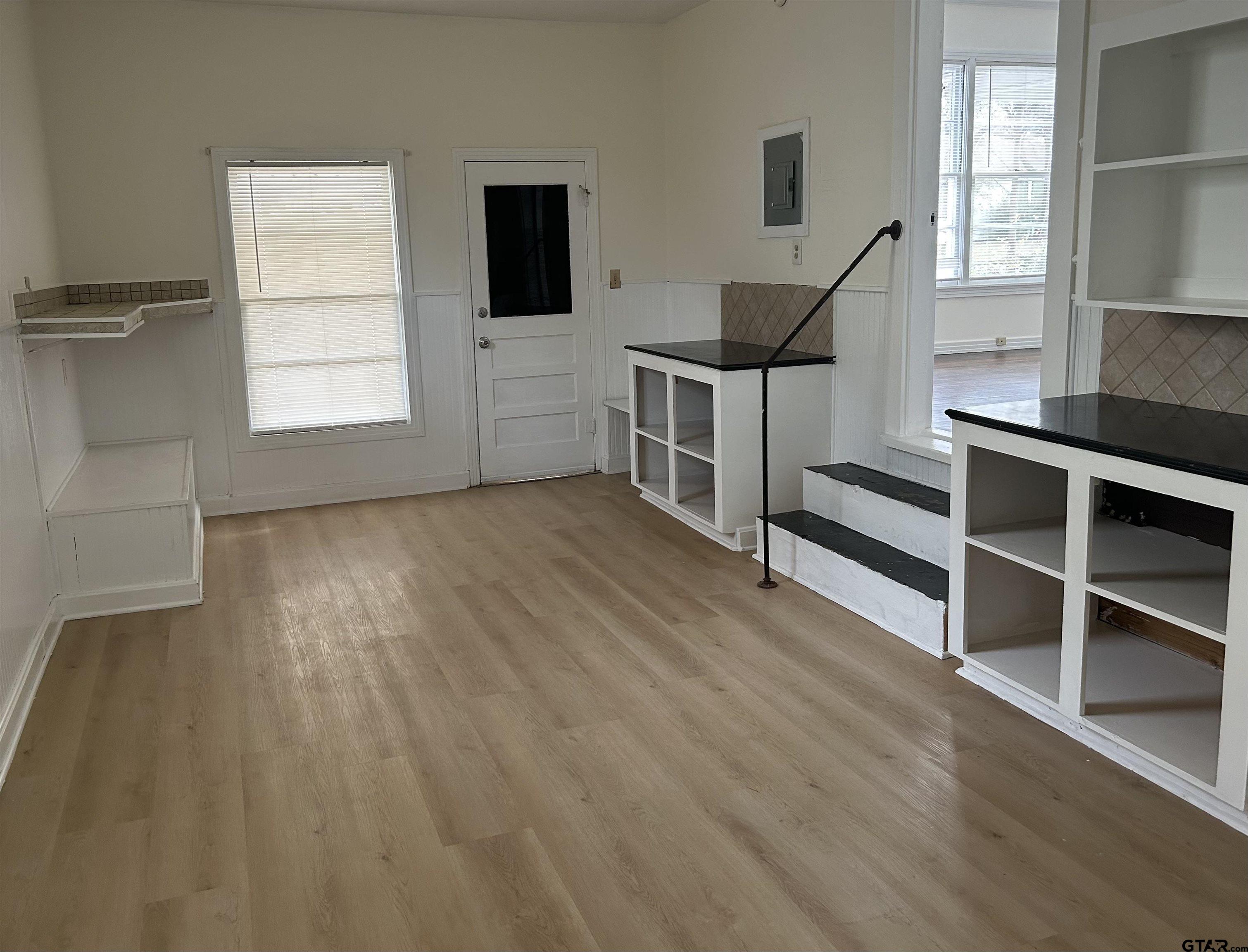509 North Line Street Mineola, TX 75773 - Photo 13 of 16 a view of a livingroom with furniture and staircase
