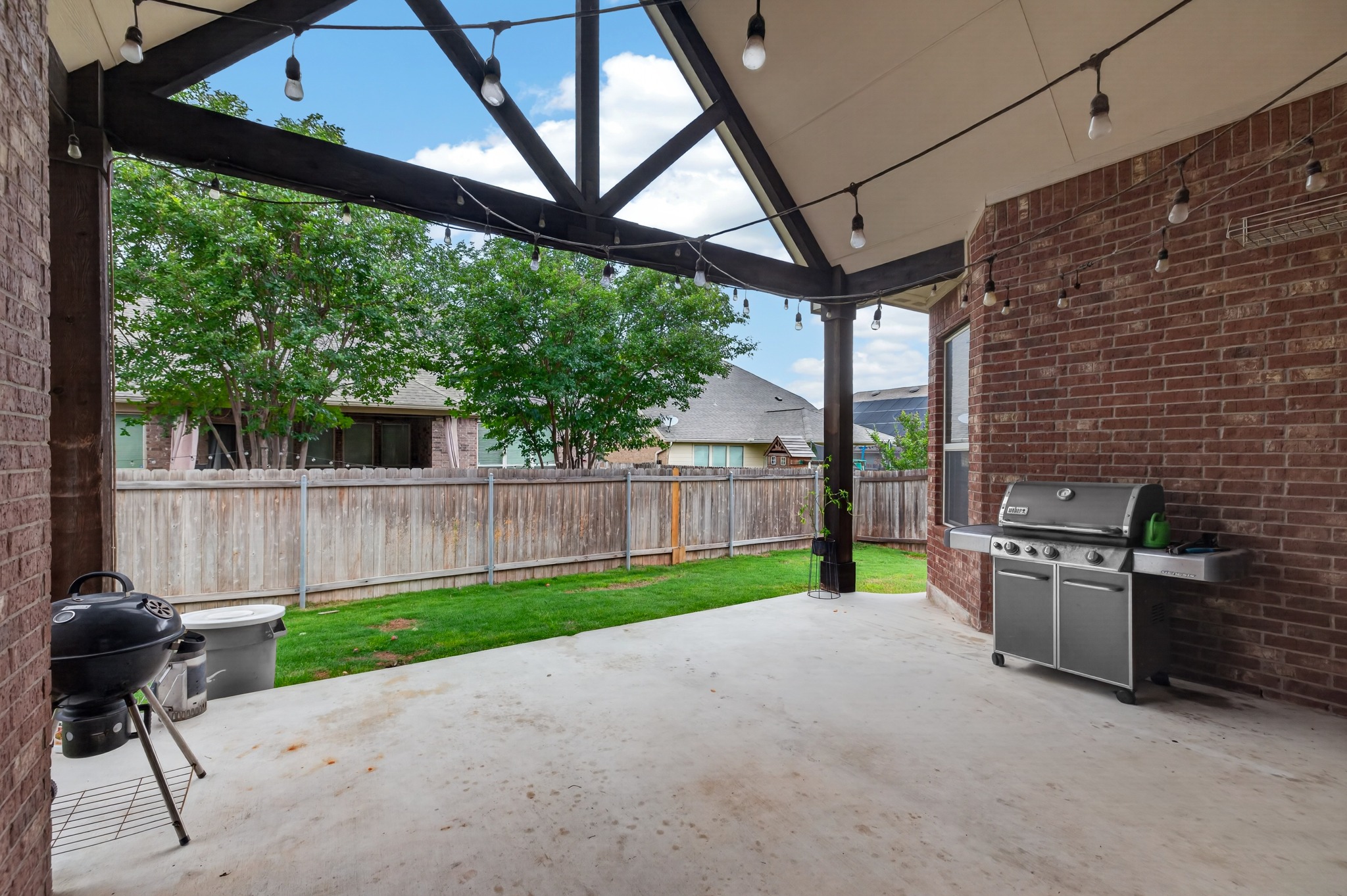 1017 Tabernash Leander, TX 78641 - Photo 38 of 38 Covered patio featuring a concrete slab and exposed wood beam ceiling