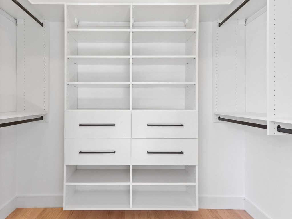 1917 Commonwealth Avenue, Unit 1917 Newton, MA 02466 - Photo 16 of 30 a view of walk in closet with empty racks