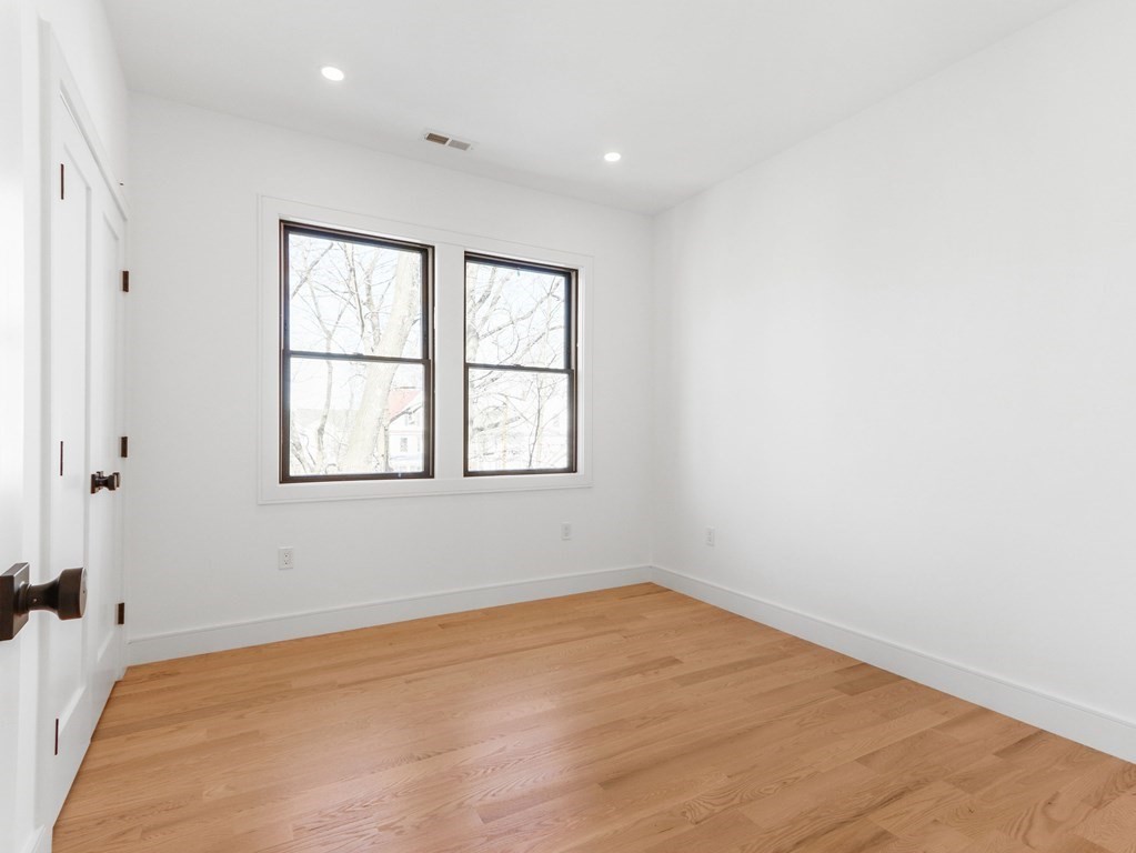 1917 Commonwealth Avenue, Unit 1917 Newton, MA 02466 - Photo 19 of 30 an empty room with a window