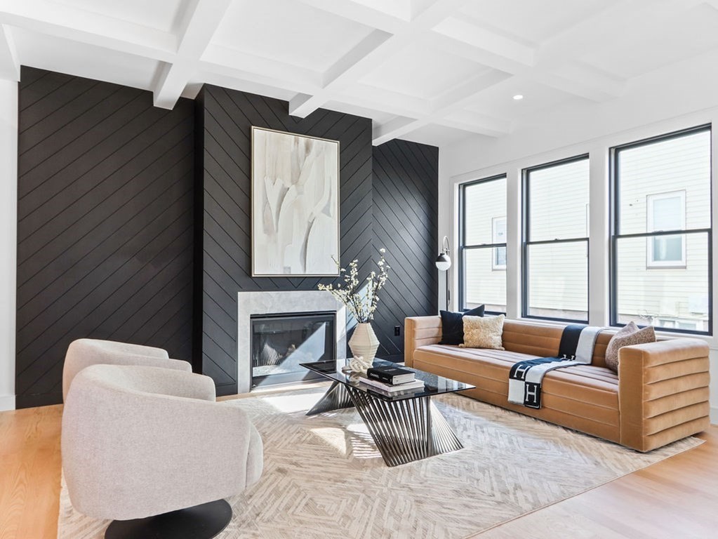1917 Commonwealth Avenue, Unit 1917 Newton, MA 02466 - Photo 2 of 30 a living room with furniture a fireplace and a large window