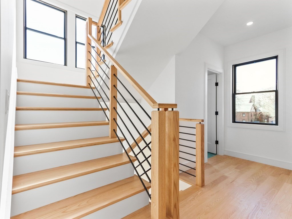 1917 Commonwealth Avenue, Unit 1917 Newton, MA 02466 - Photo 21 of 30 a view of entryway with wooden floor and stairs