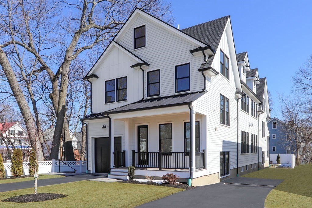 1917 Commonwealth Avenue, Unit 1917 Newton, MA 02466 - Photo 29 of 30 a view of a white house with a large windows