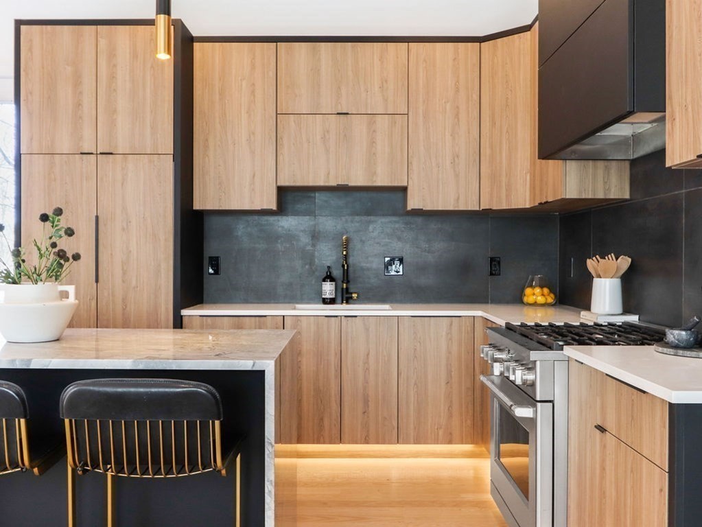 1917 Commonwealth Avenue, Unit 1917 Newton, MA 02466 - Photo 8 of 30 a kitchen with stainless steel appliances granite countertop a stove a sink and a white cabinets