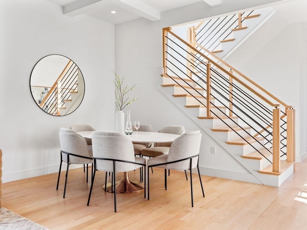 1917 Commonwealth Avenue, Unit 1917 Newton, MA 02466 - Photo 9 of 30 a view of a dining room with furniture and wooden floor