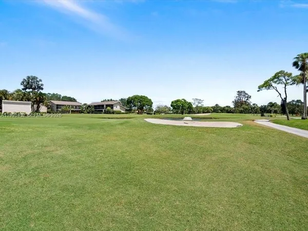 a view of a lake with a big yard