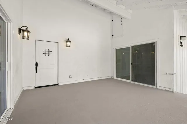 a pathway of a house with a yard