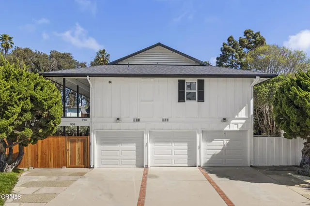 an aerial view of a houses with yard