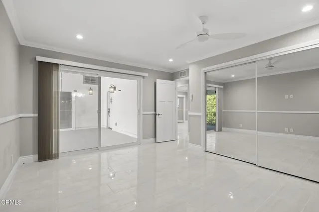 a bathroom with a glass shower door and a shower