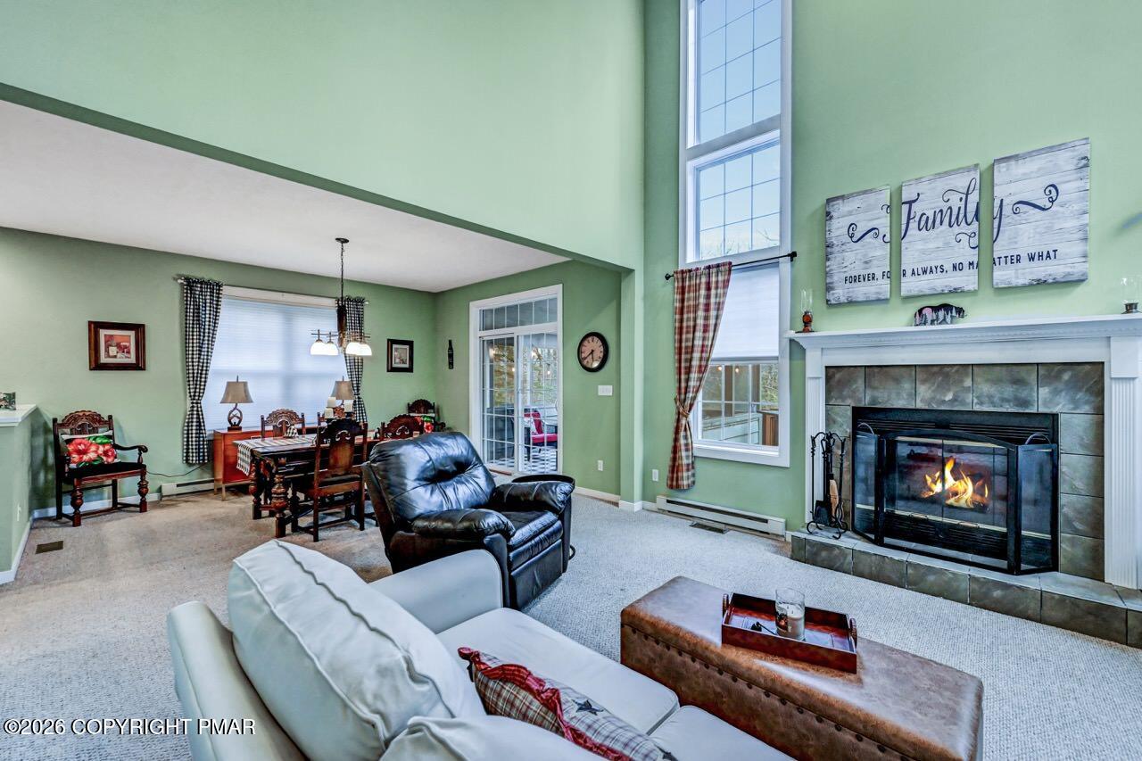 151 Skytop Road Long Pond, PA 18334 - Photo 1 of 36 a living room with furniture and a fireplace