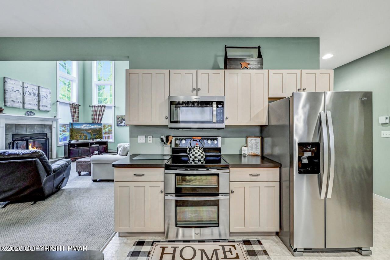 151 Skytop Road Long Pond, PA 18334 - Photo 11 of 36 a kitchen with stainless steel appliances a stove a refrigerator and a sink