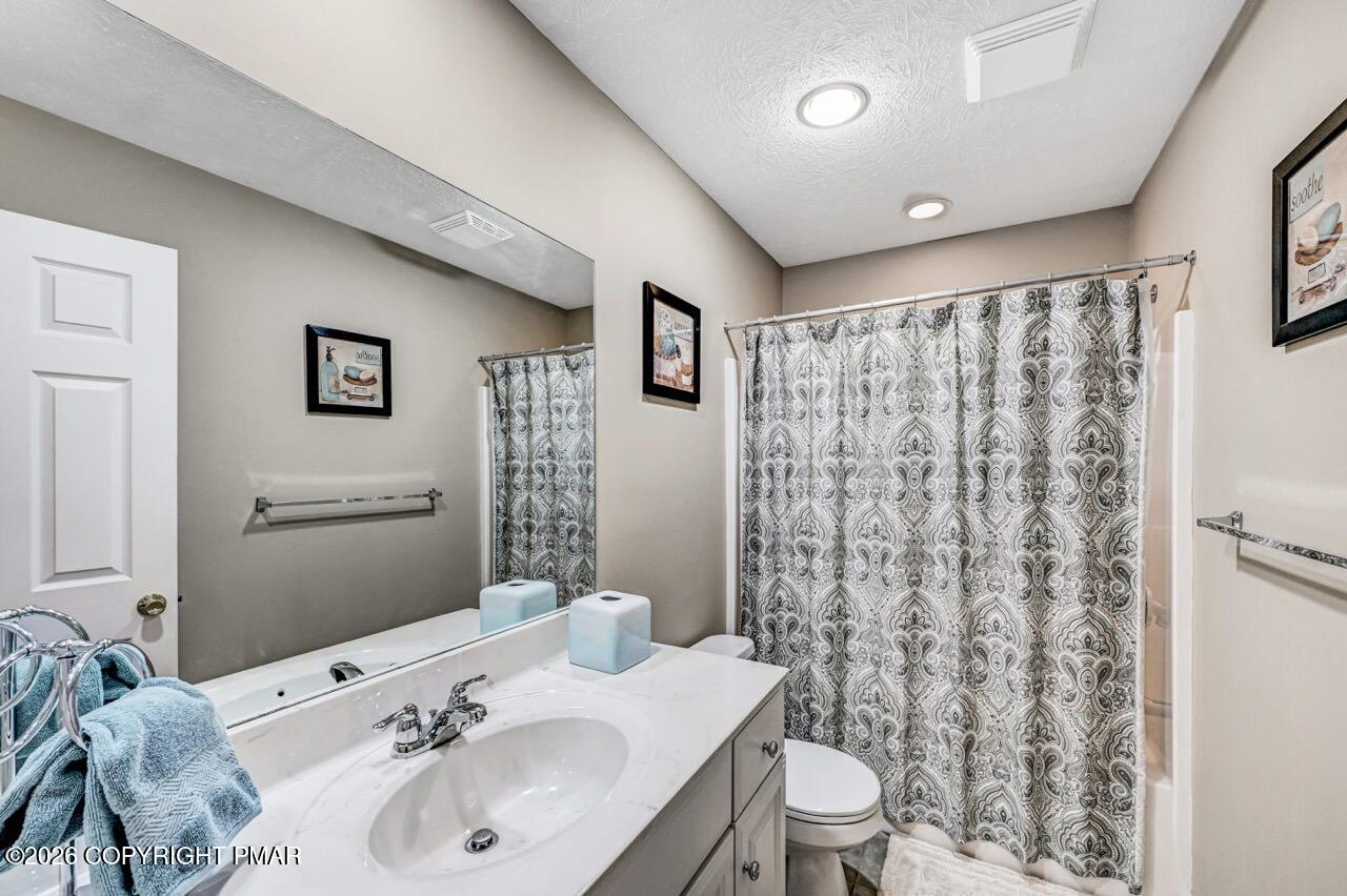 151 Skytop Road Long Pond, PA 18334 - Photo 25 of 36 a bathroom with a sink toilet and shower