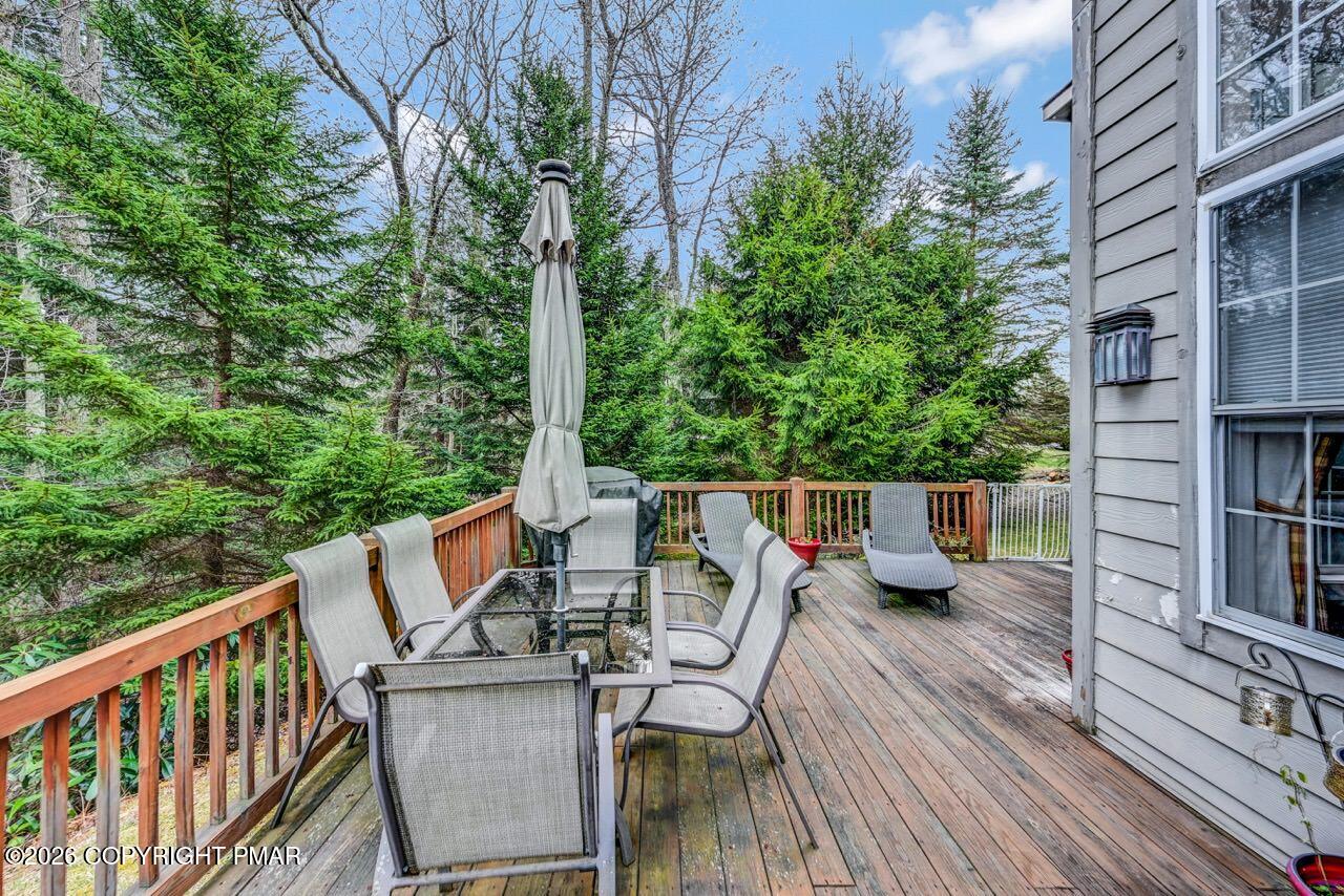 151 Skytop Road Long Pond, PA 18334 - Photo 32 of 36 a view of deck with furniture and trees