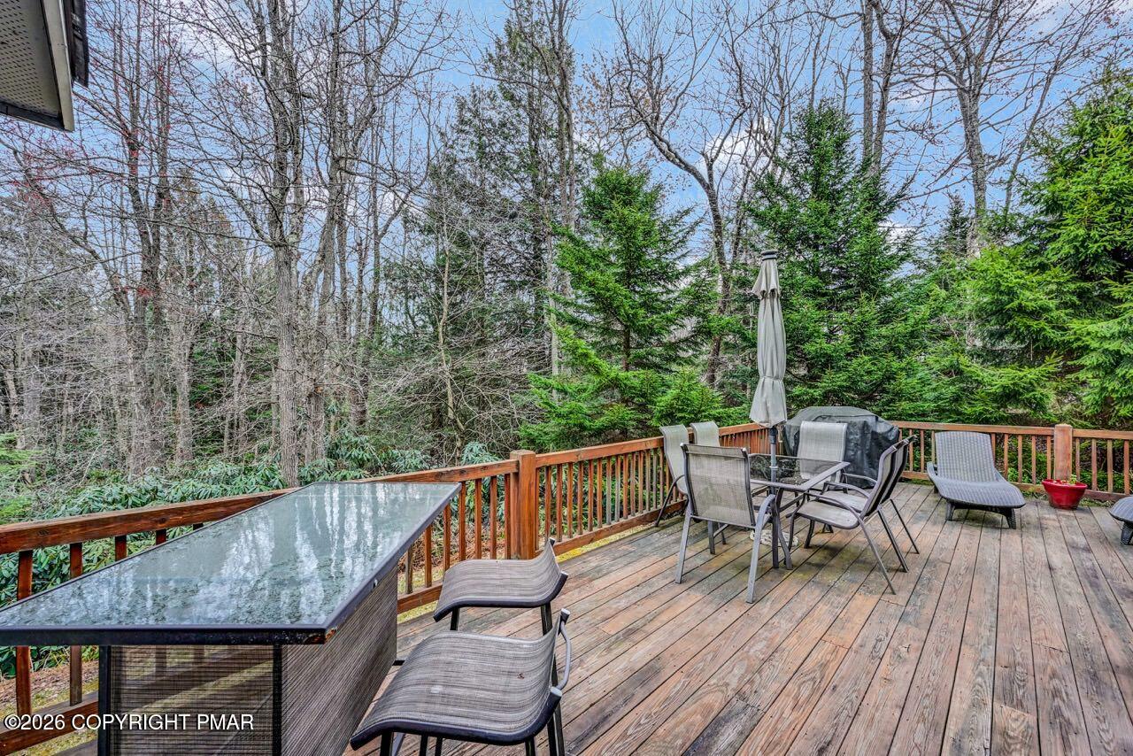 151 Skytop Road Long Pond, PA 18334 - Photo 33 of 36 a view of house with deck and outdoor seating