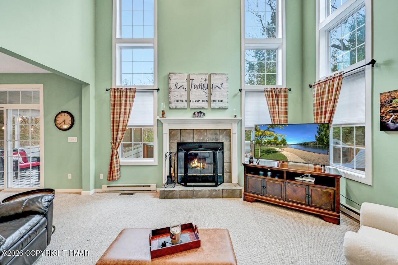 151 Skytop Road Long Pond, PA 18334 - Photo 4 of 36 a living room with furniture and a fireplace