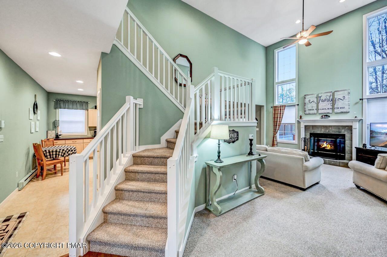 151 Skytop Road Long Pond, PA 18334 - Photo 6 of 36 a living room with furniture and a fireplace