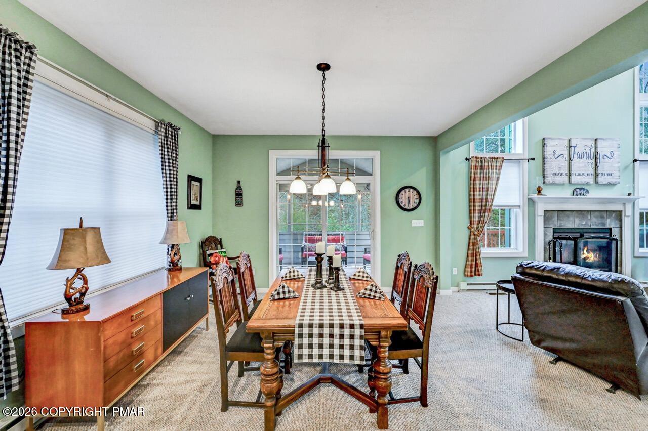 151 Skytop Road Long Pond, PA 18334 - Photo 7 of 36 a dining room with furniture a livingroom and chandelier