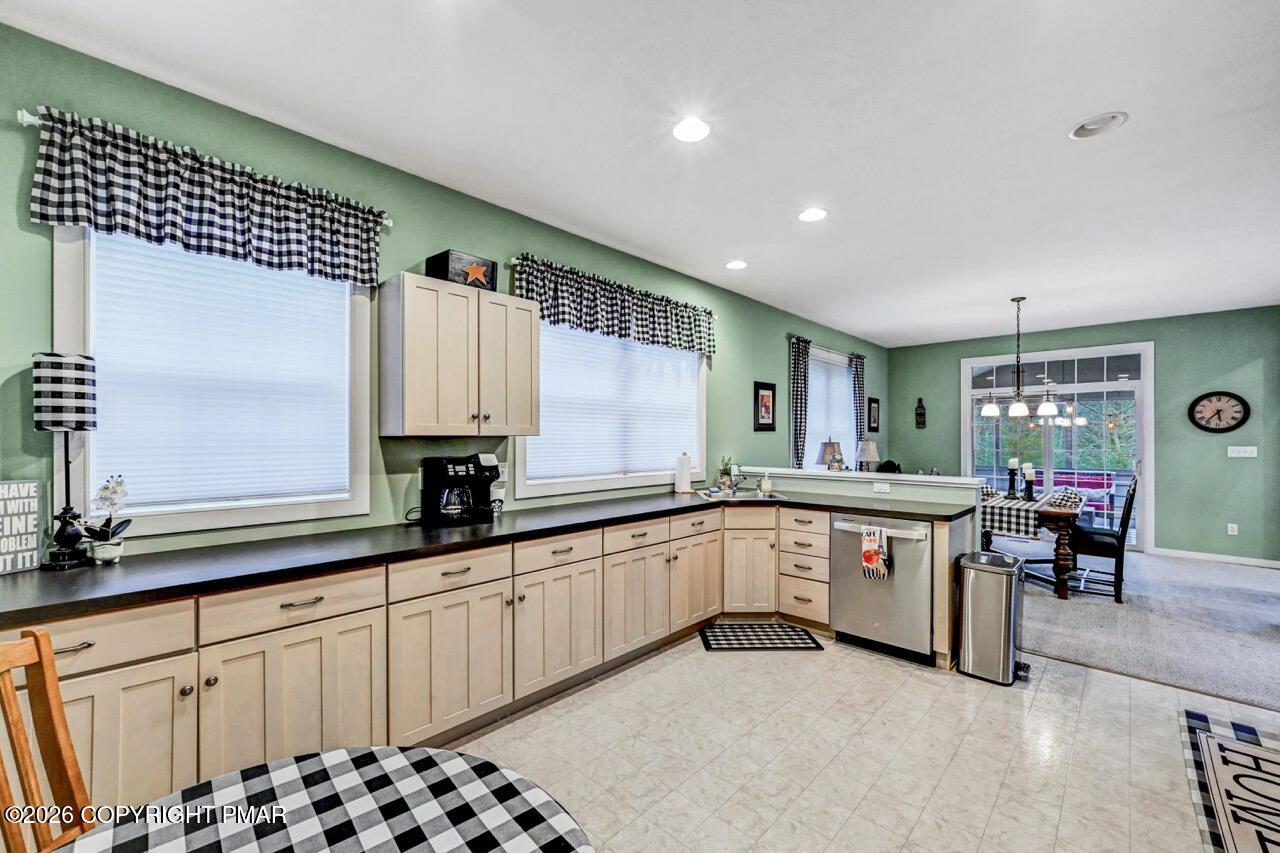 151 Skytop Road Long Pond, PA 18334 - Photo 10 of 36 a kitchen with granite countertop a sink and cabinets