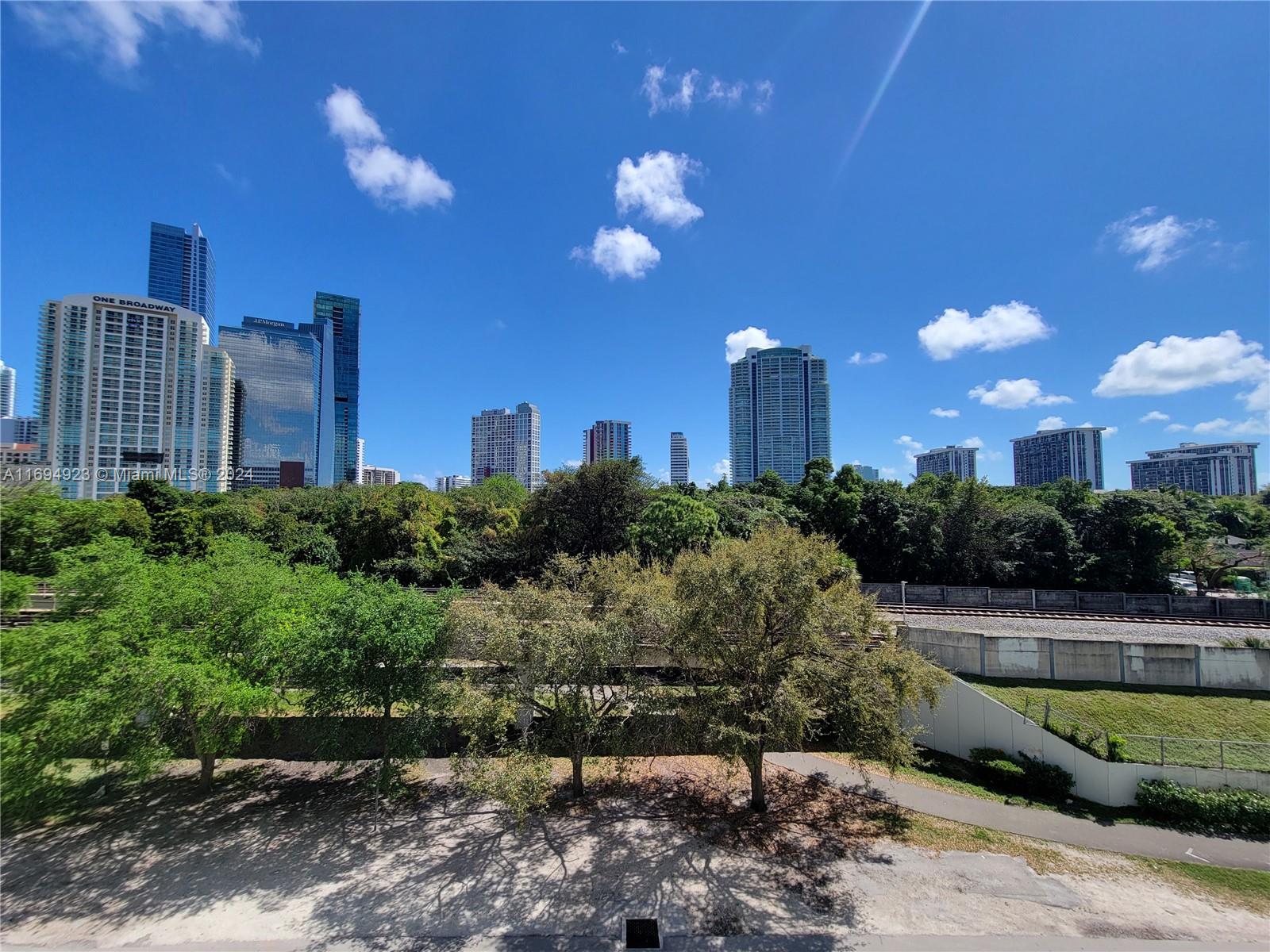1600 Southwest 1st Avenue, Unit 411 Miami, FL 33129 - Photo 13 of 15 a view of a building with a yard