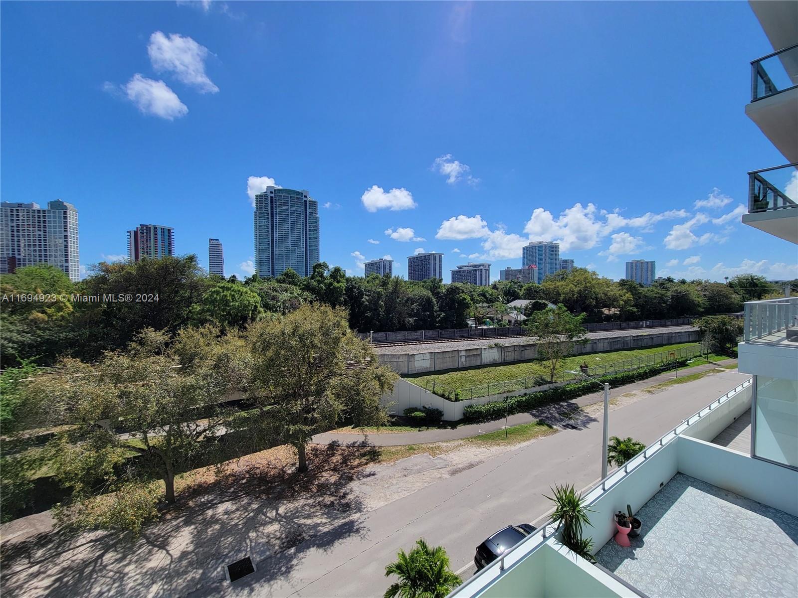 1600 Southwest 1st Avenue, Unit 411 Miami, FL 33129 - Photo 14 of 15 a view of a city street from a balcony