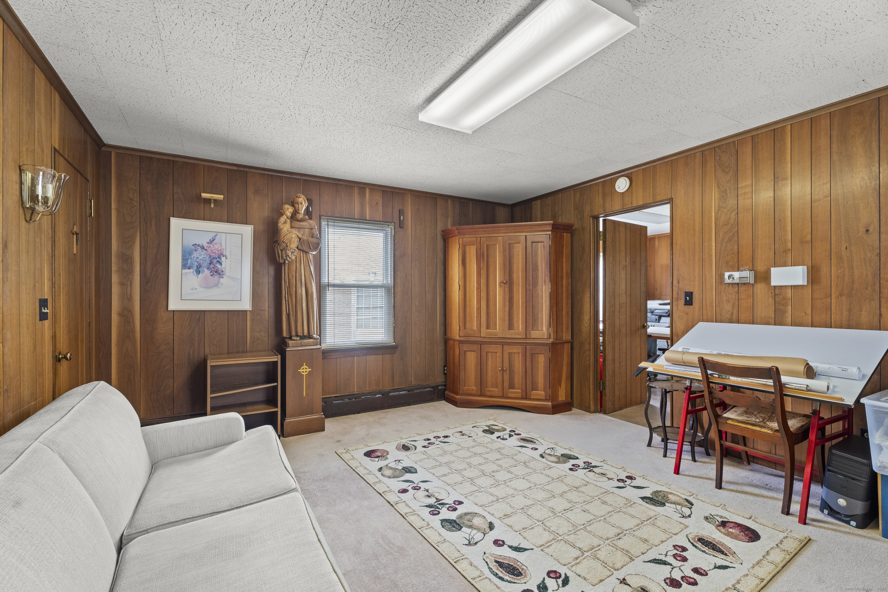 32 East Main Street Mystic, CT 06355 - Photo 14 of 40 a bedroom with furniture and a wooden floor