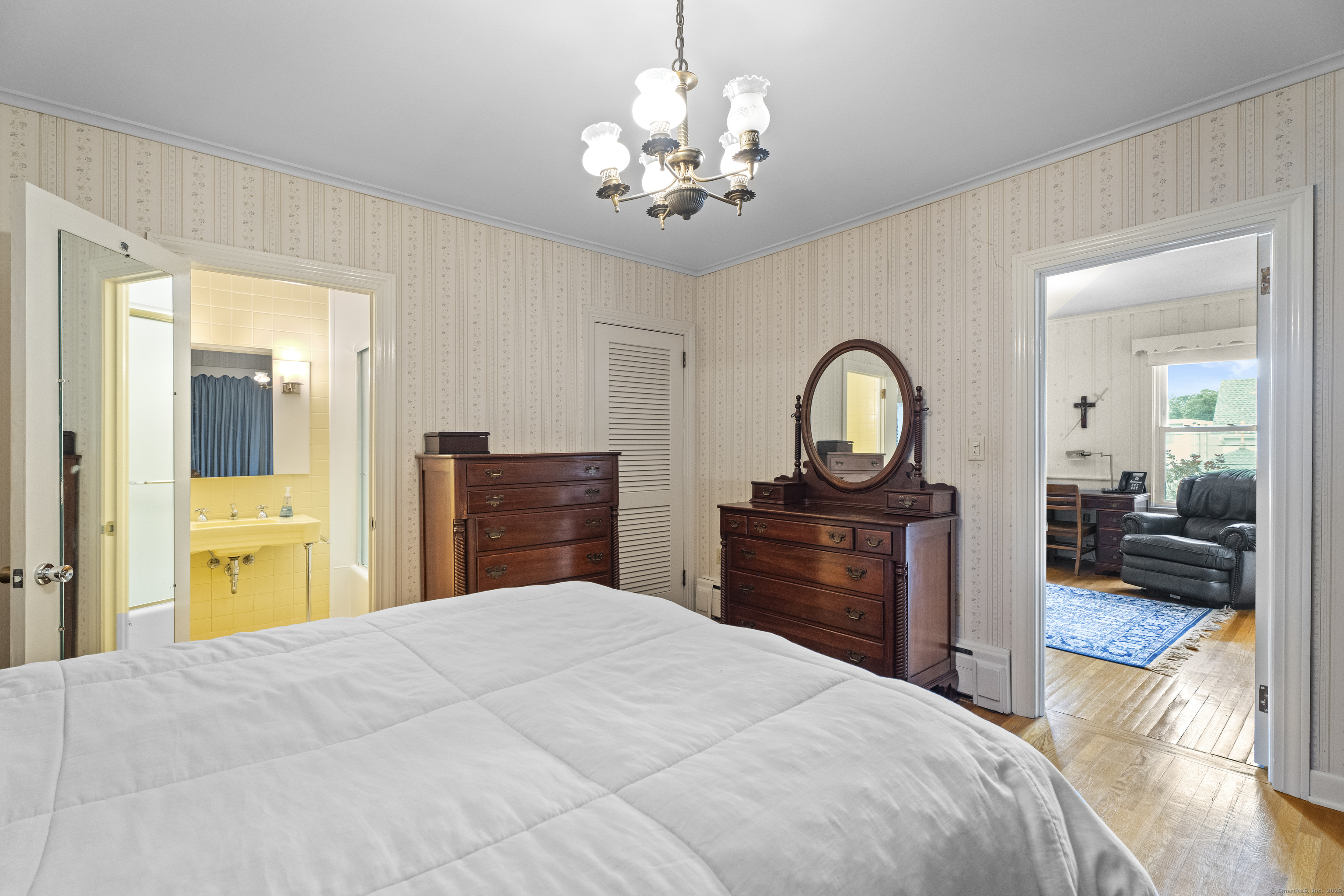 32 East Main Street Mystic, CT 06355 - Photo 23 of 40 a bedroom with a bed and a dresser