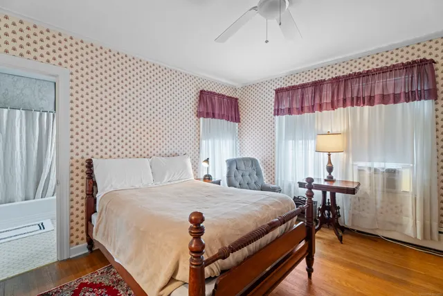 a bedroom with a bed and a table