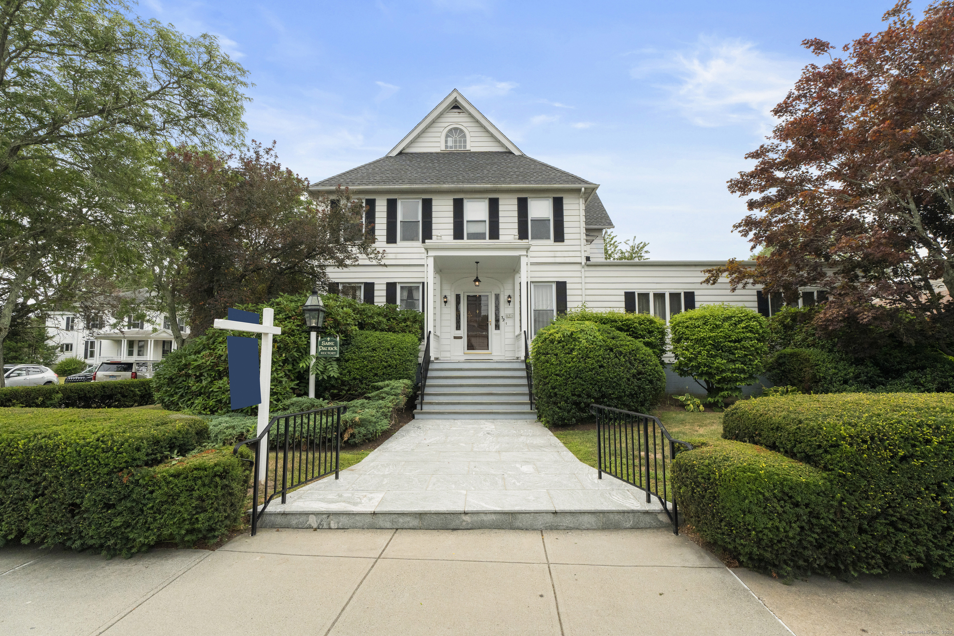 32 East Main Street Mystic, CT 06355 - Photo 31 of 40 a front view of house with yard and green space