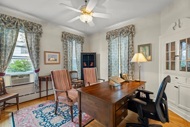 a view of a dining room with furniture and window