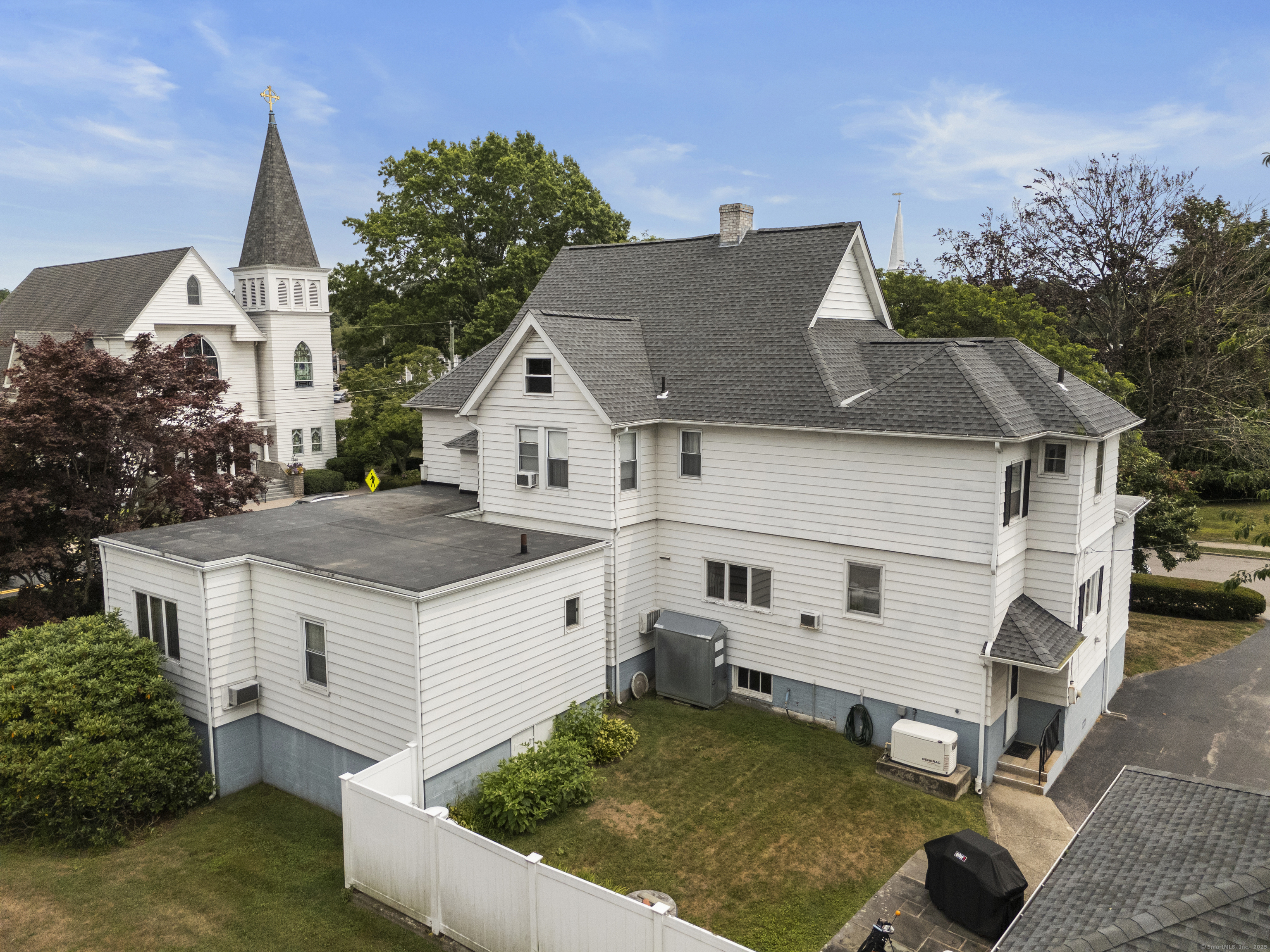 32 East Main Street Mystic, CT 06355 - Photo 9 of 40 a view of house with backyard porch and furniture