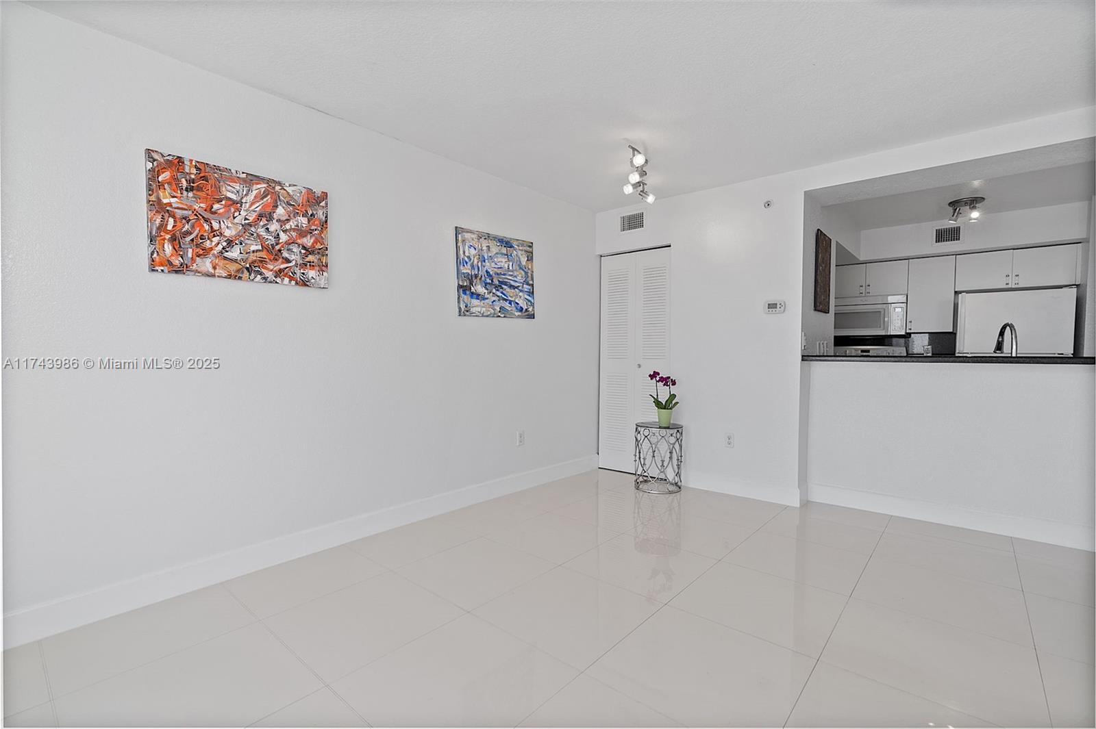 219 Northwest 12th Avenue, Unit 809 Miami, FL 33128 - Photo 13 of 32 a view of a kitchen with wooden floor