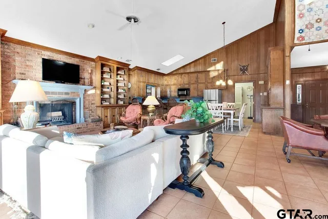 a living room with fireplace furniture and a flat screen tv
