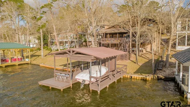 a swimming pool with outdoor seating and yard