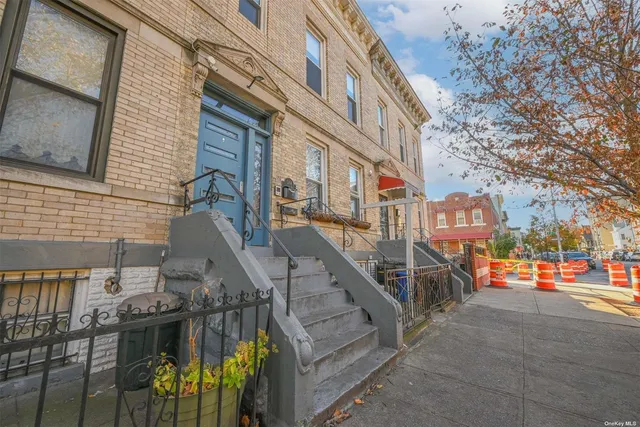 a view of a building with cars