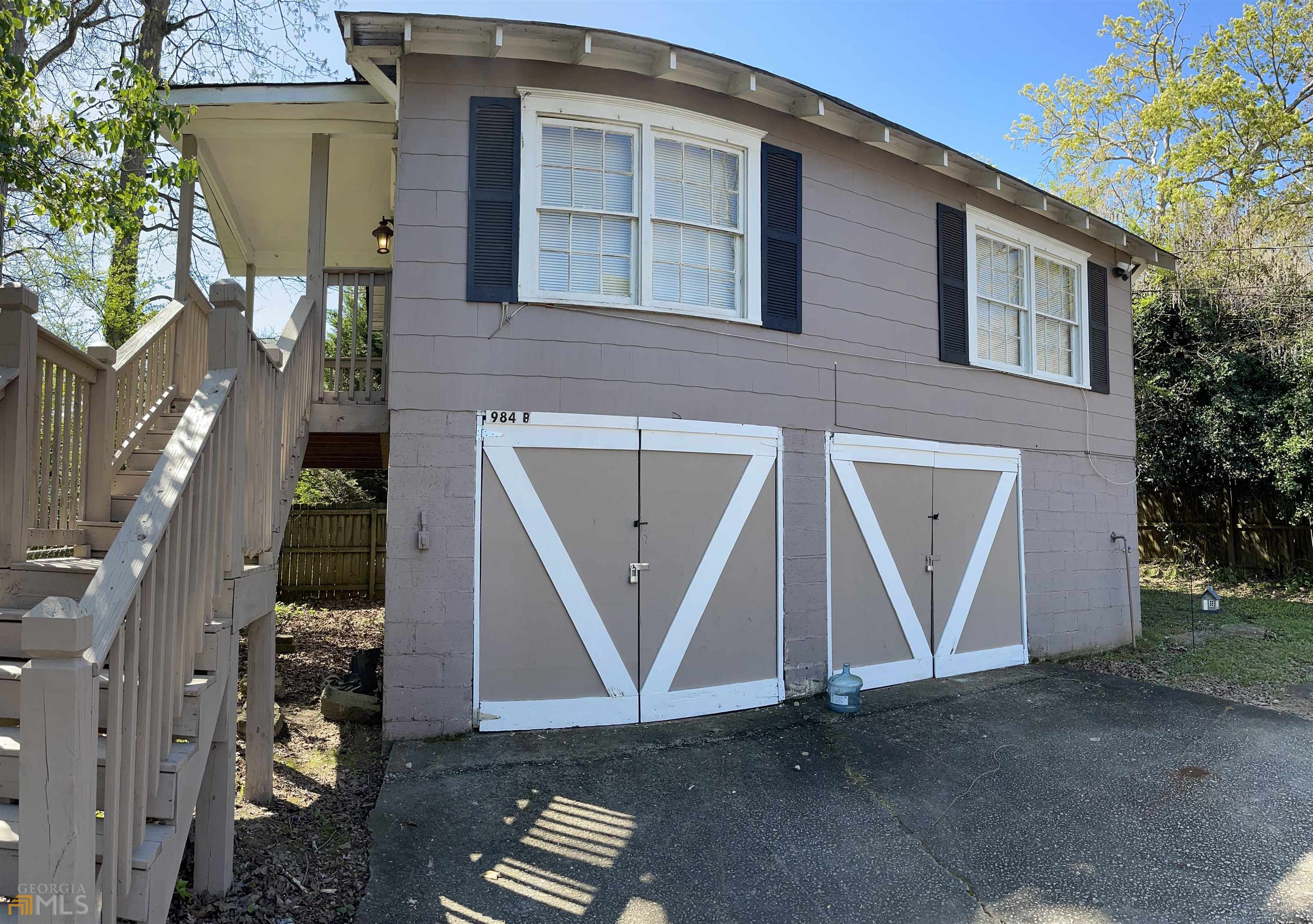 a front view of a house with stairs