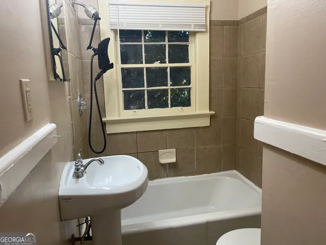 a bathroom with a sink and a bathtub
