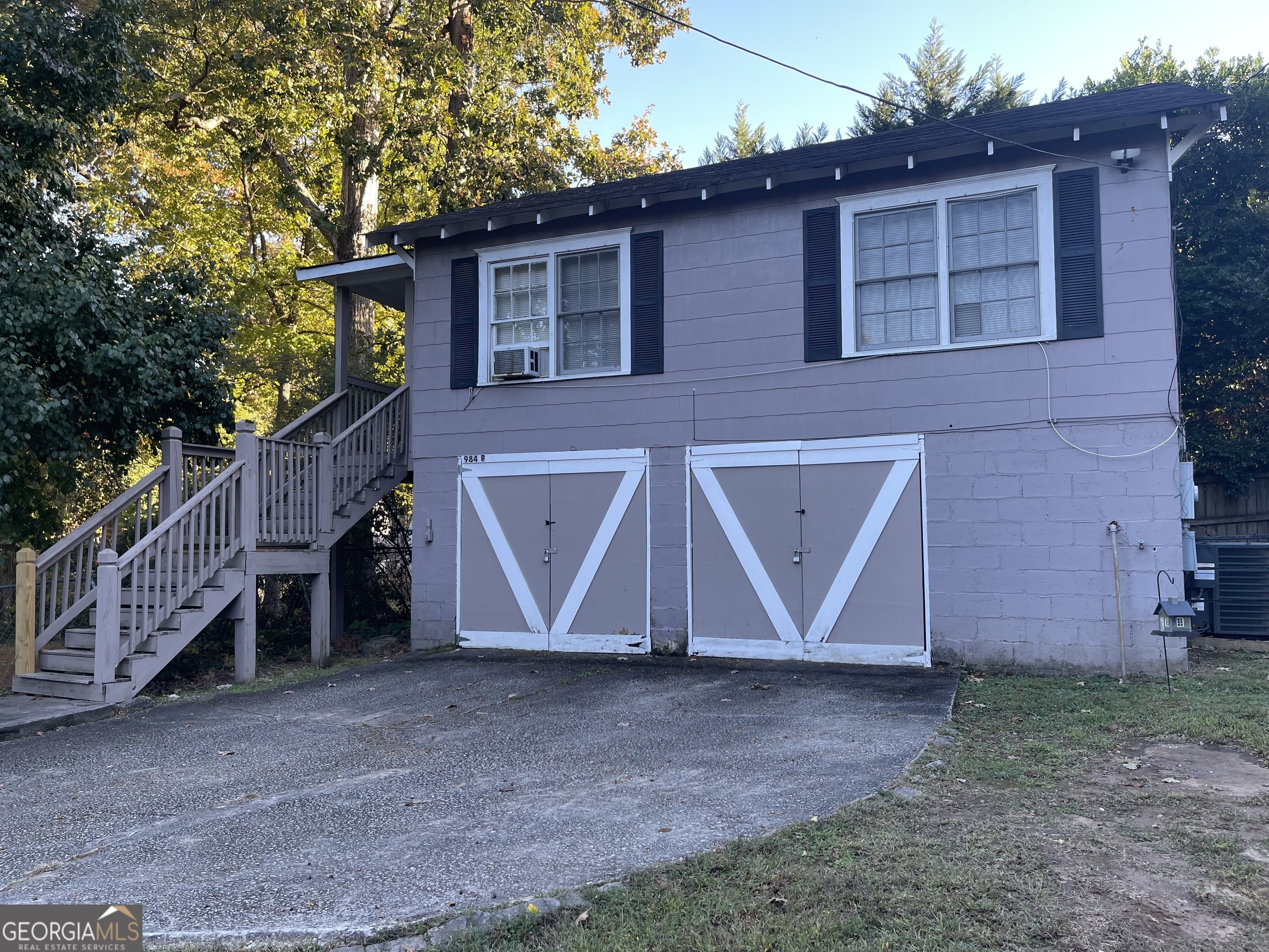984 Byron Drive Southwest, Unit B Atlanta, GA 30310 - Photo 2 of 13 a view of a house with a yard and garage