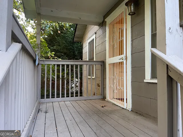 a view of balcony with wooden floor
