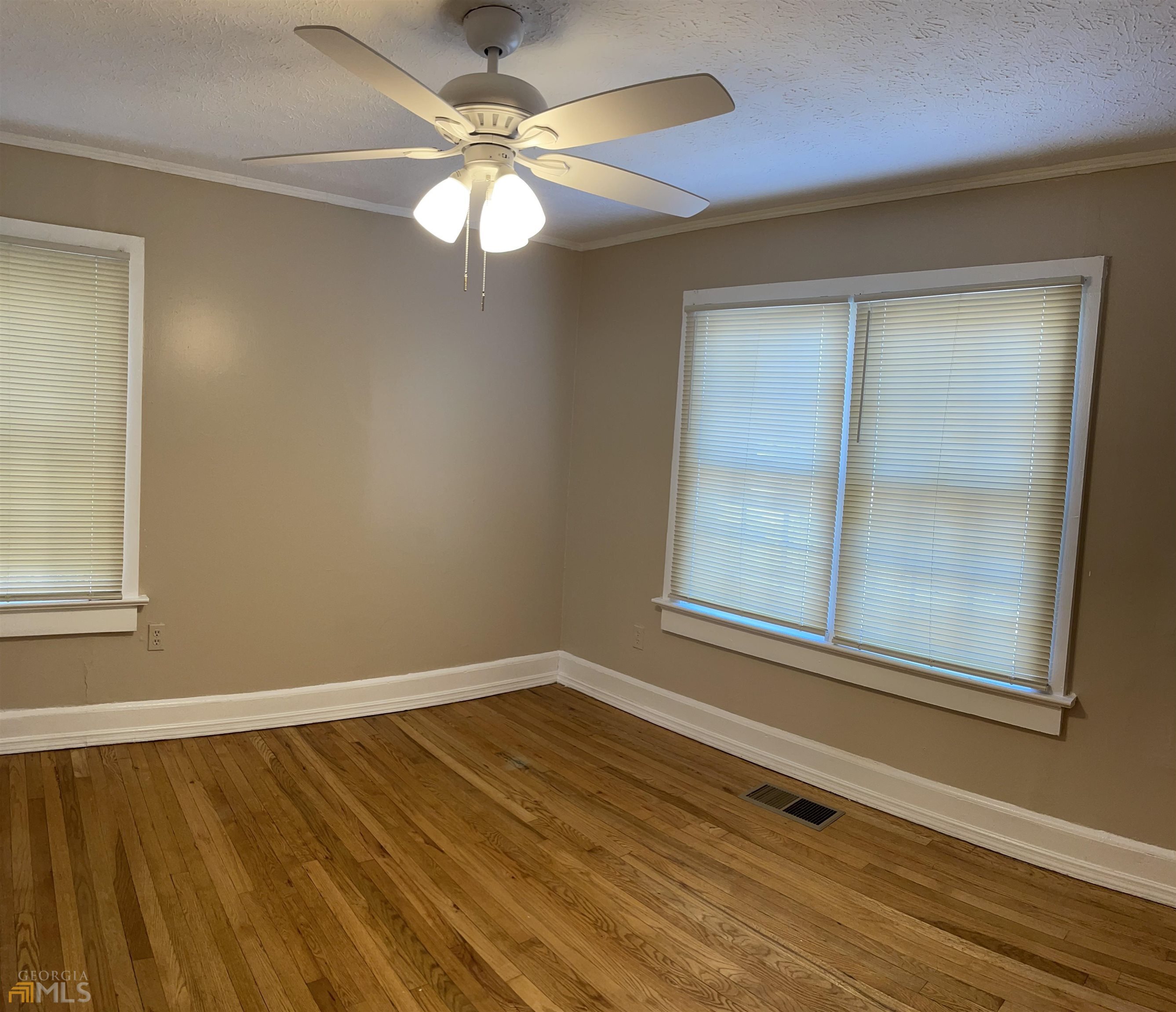 984 Byron Drive Southwest, Unit B Atlanta, GA 30310 - Photo 10 of 13 a view of an empty room with wooden floor and a window