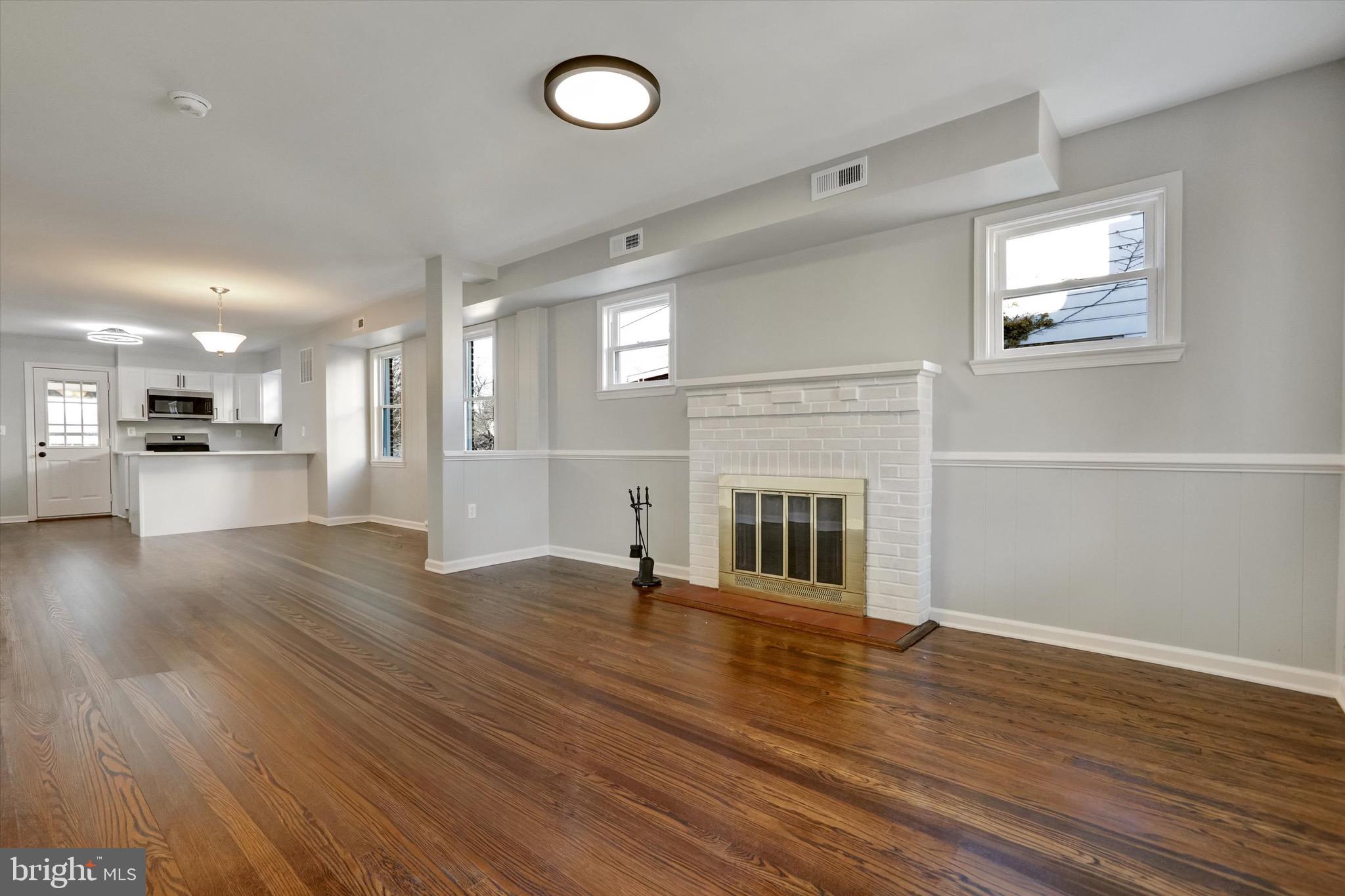 3111 Willoughby Road Baltimore, MD 21234 - Photo 45 of 45 a view of a livingroom with wooden floor and a kitchen