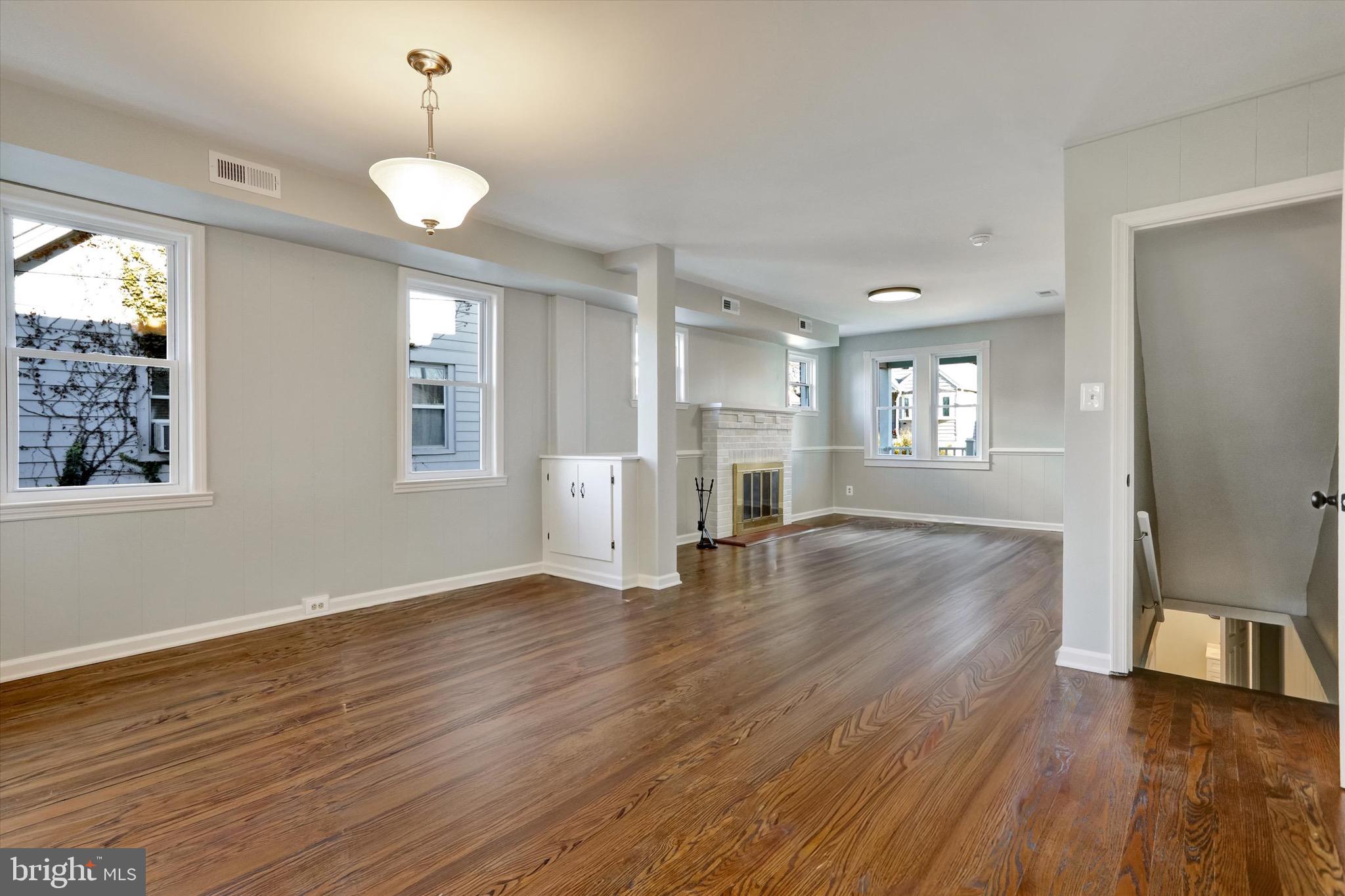 3111 Willoughby Road Baltimore, MD 21234 - Photo 13 of 45 a view of an empty room with wooden floor and a window