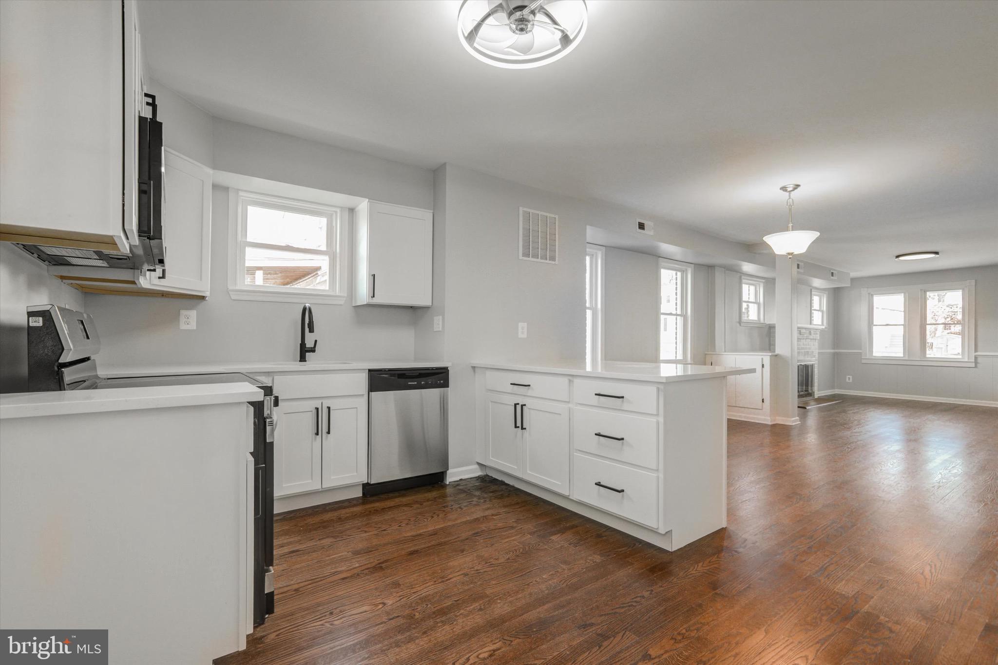 3111 Willoughby Road Baltimore, MD 21234 - Photo 16 of 45 a kitchen with white cabinets and sink